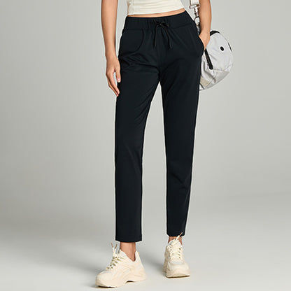Women's loose straight-leg cropped pants with elastic drawstring waist, shown in a relaxed casual style