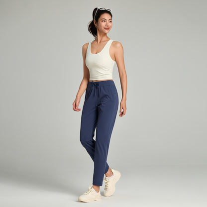 Women's loose straight-leg cropped pants with a drawstring waist, shown in a relaxed casual style