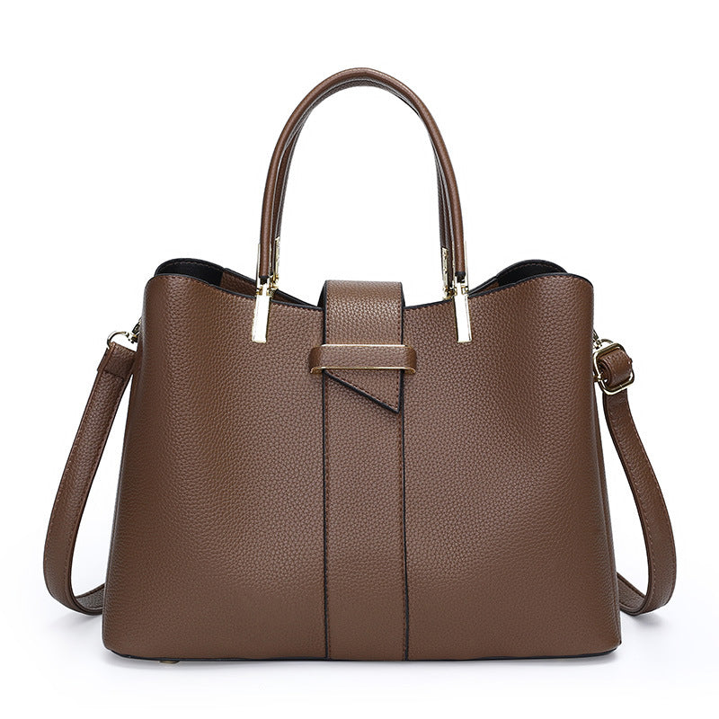 Retro bucket handbag with removable crossbody strap shown from the side, highlighting its structured silhouette and vintage-i