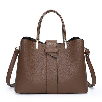 Retro bucket handbag with removable crossbody strap shown from the side, highlighting its structured silhouette and vintage-i
