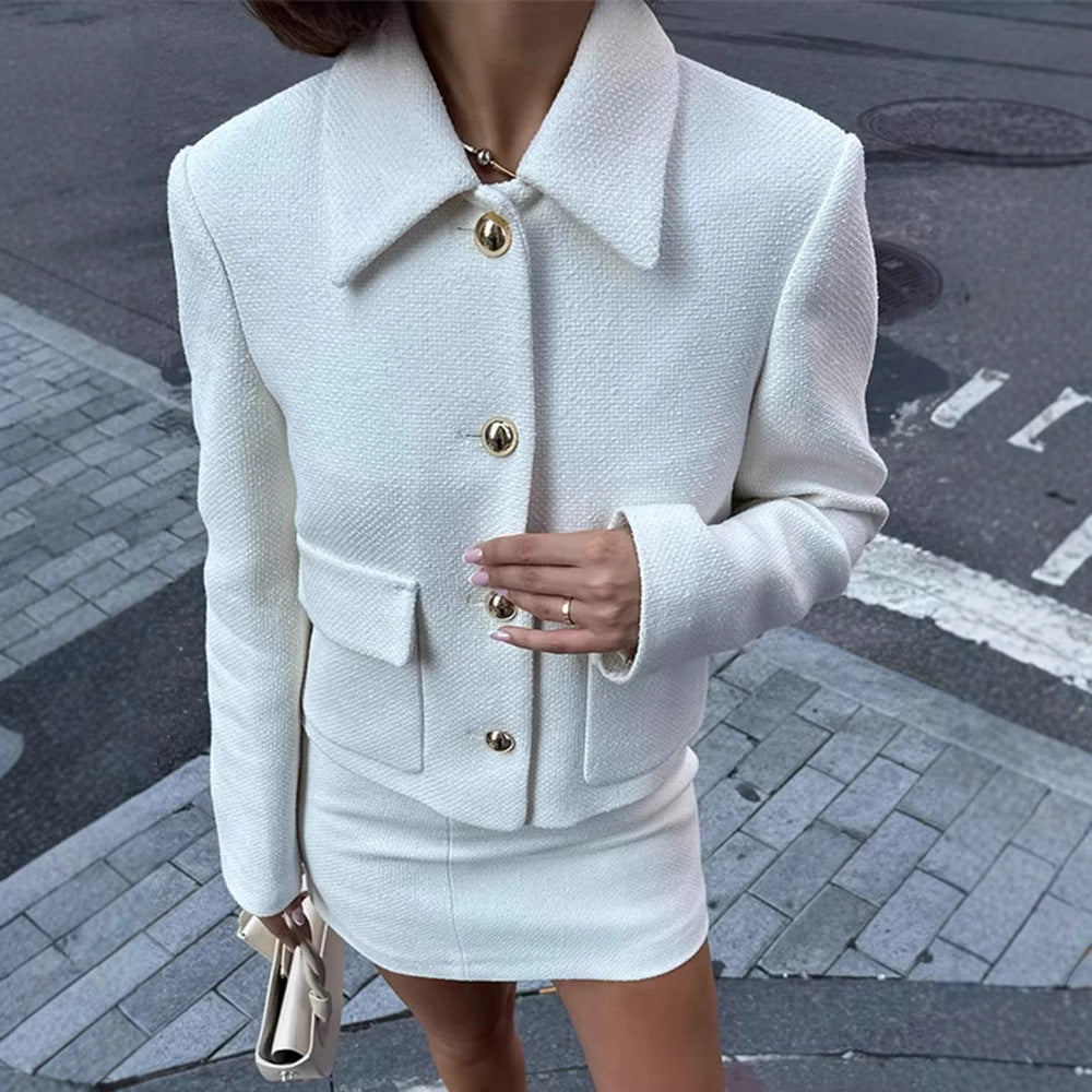Women's tweed coat and skirt two-piece suit set displayed in a close-up detail view showing fabric texture and tailoring