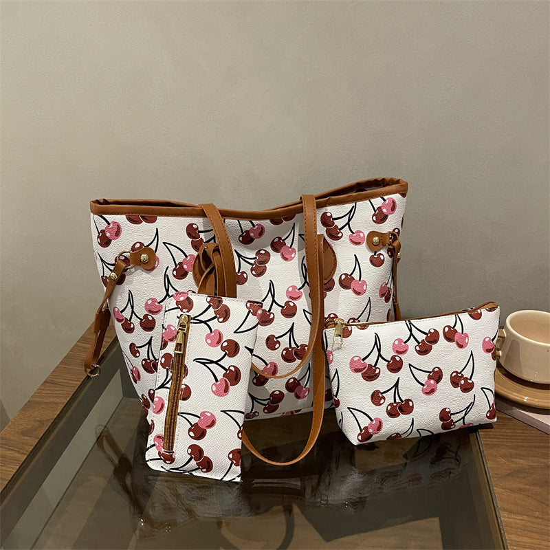 Women's large capacity tote bag with underarm strap, shown in a neutral tone with structured silhouette and dual carry option