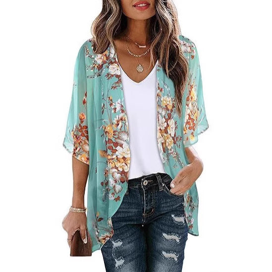 Sheer floral chiffon cardigan beach cover-up draped open, showing lightweight fabric and delicate print detail