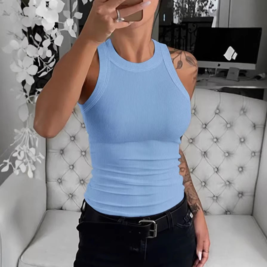 Women's slim-fit sleeveless ribbed knit vest top in a neutral tone, shown as a wardrobe essential layering piece