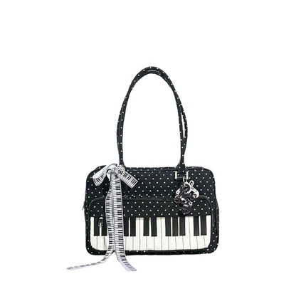 Black and white polka dot shoulder bag with piano key accent, lightweight women's casual everyday bag