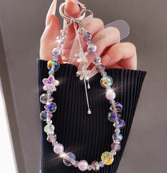 Crystal beaded phone lanyard bracelet with card holder and tassel charm, worn as a wrist strap with colorful decorative beads