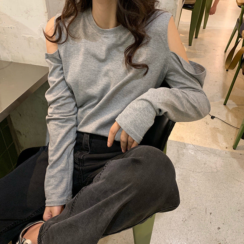 Women's off-shoulder long sleeve top in a stretch fit style, shown from a side angle highlighting the neckline and sleeve det