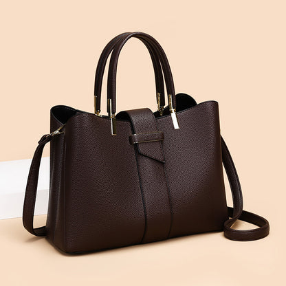 Retro women's bucket handbag with adjustable crossbody strap, shown in a close-up detail view highlighting the bag's texture 
