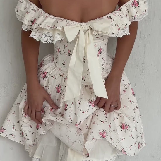 Floral Bow Off-Shoulder Mini Dress in motion
