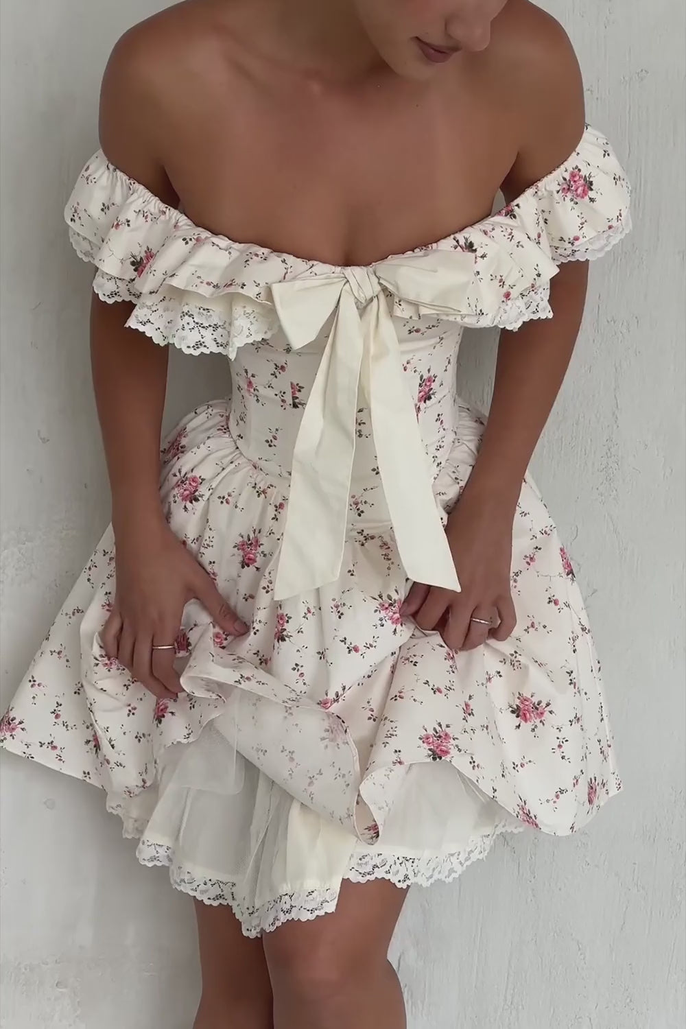 Floral Bow Off-Shoulder Mini Dress in motion