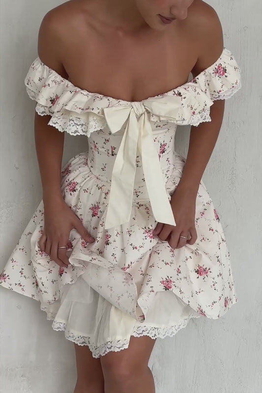 Floral Bow Off-Shoulder Mini Dress in motion